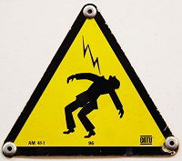 What effect does an electric shock have on the human body?