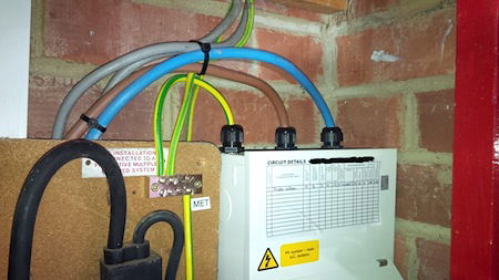 Q & A of the Day – With this metal CU, excluding an SWA with separate CPC, should they should enter via the same hole?