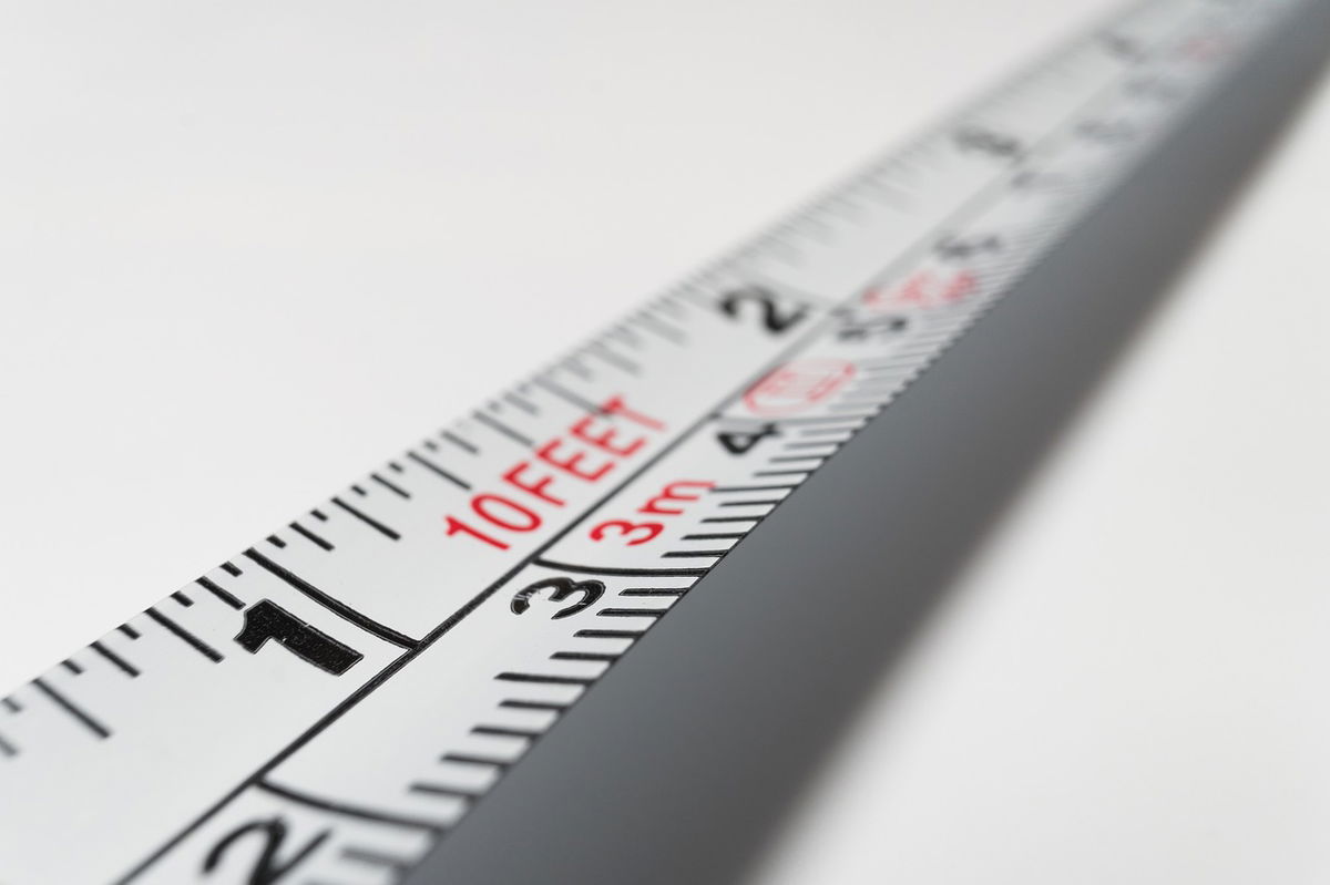 What is the recommended distance between cable and central heating pipes?