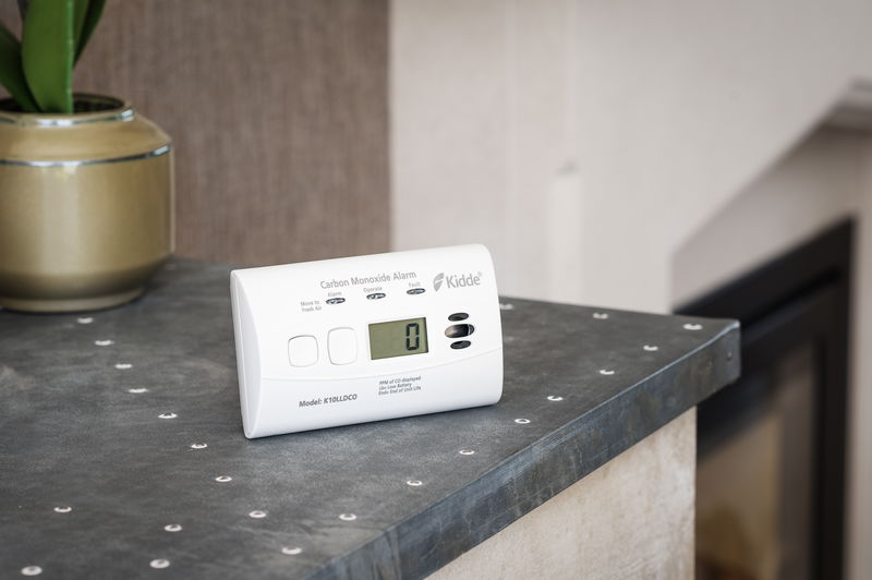Where should carbon monoxide (CO) alarms be placed?